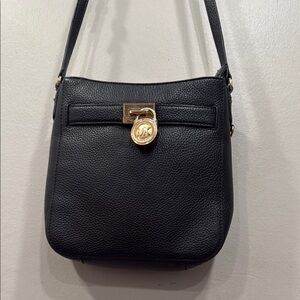 Michael Kors Black and Gold Crossbody Bag with Structured Design